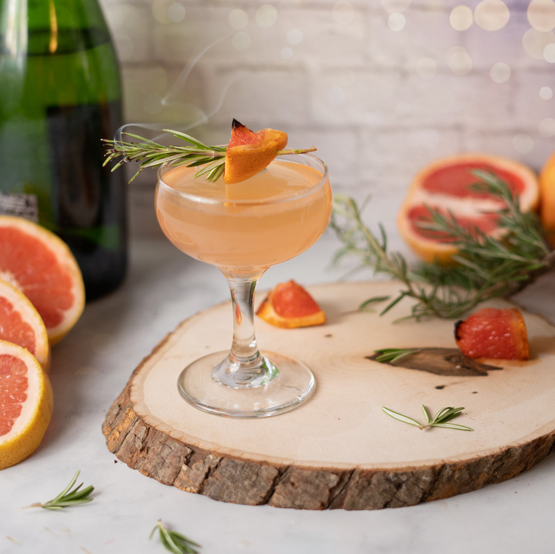 charred sugared grapefruit with rosemary sprig