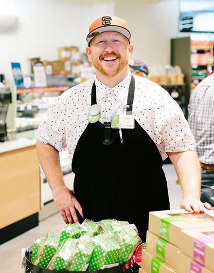 a smiling man in an apron