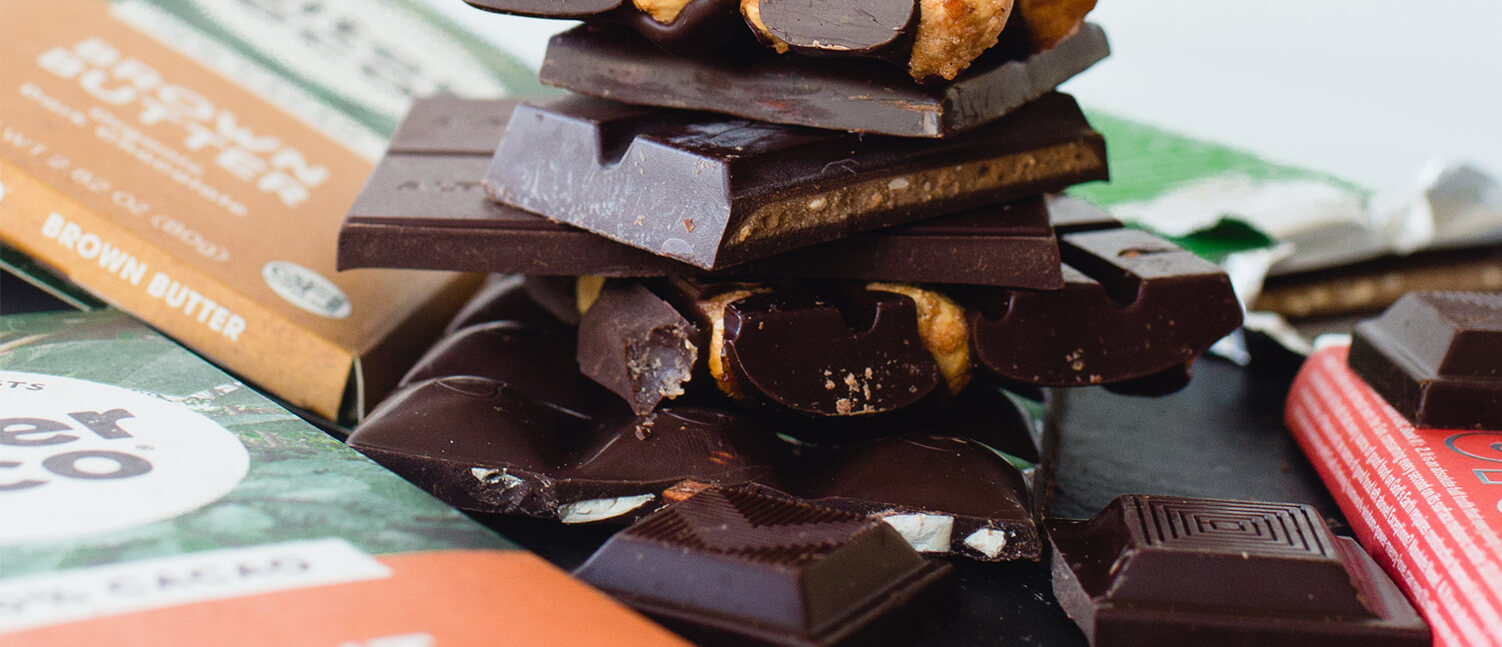 bars of chocolate in packages and broken in pieces