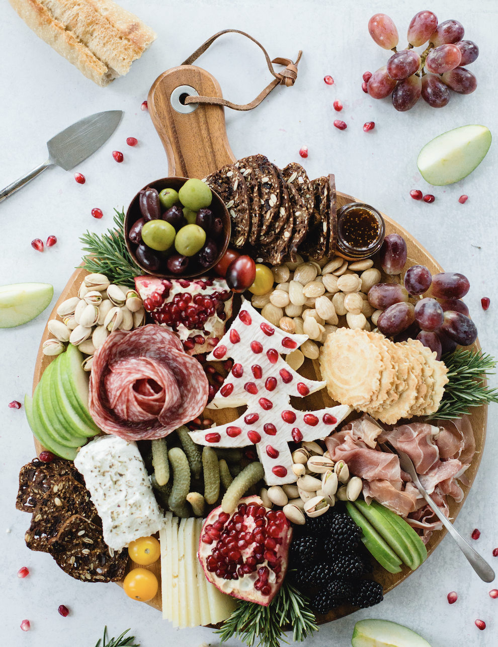salmon, asparagus, and lemon wedges on a wooden cutting board