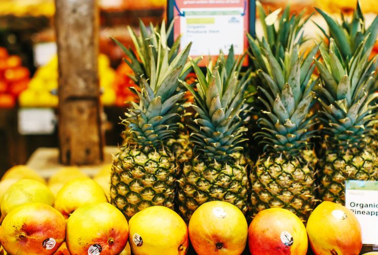 pineapples and mangoes on a table