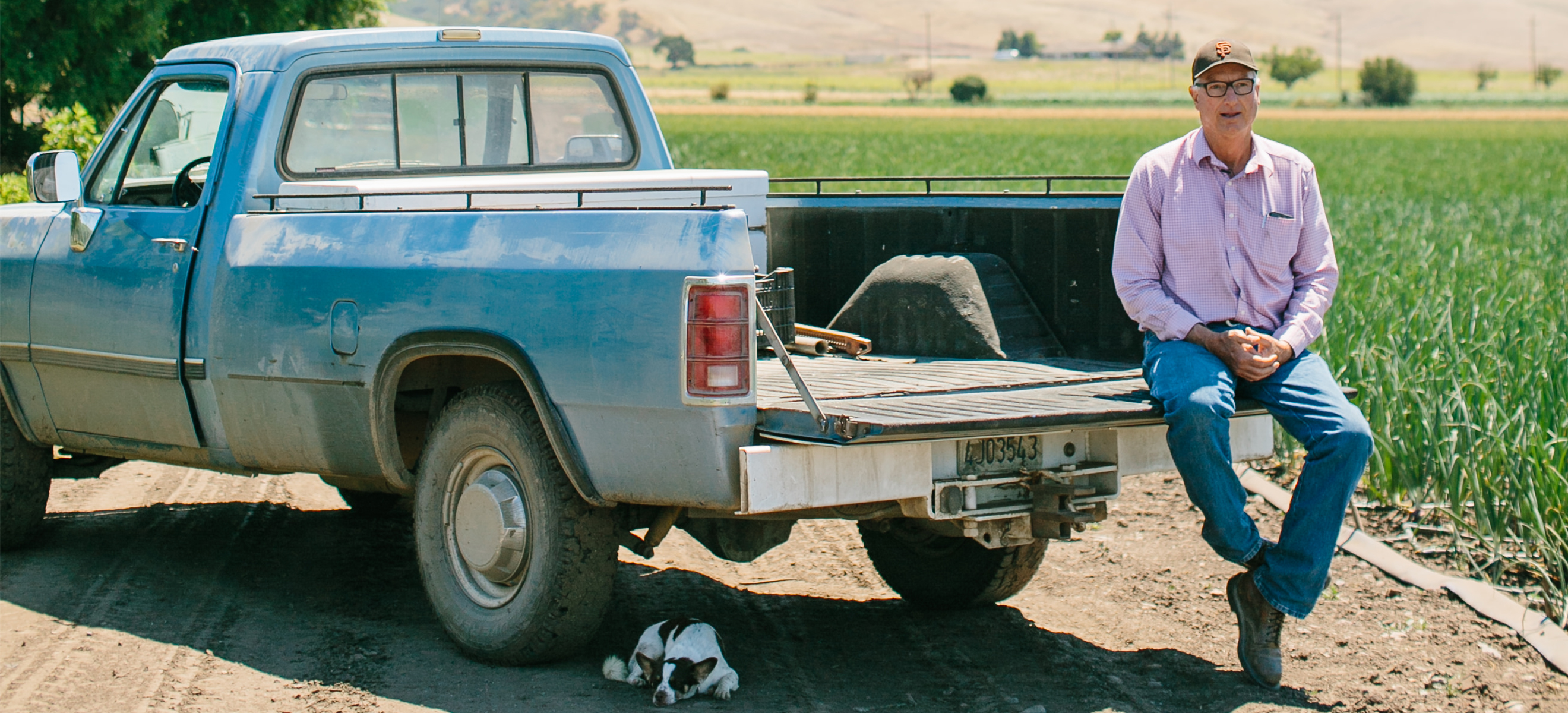 man sitting on truck bed