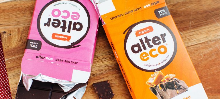 Chocolate bars on a wooden cutting board.